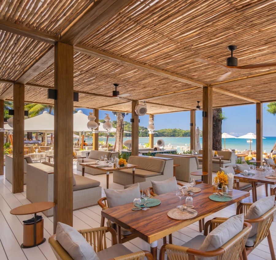 Catch Beach Club outdoor hospitality seating, pictured in the book.