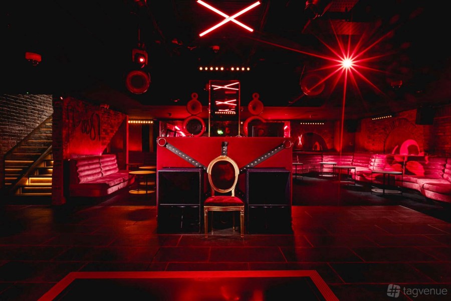 Dear Darling nightclub interior with red lighting, pictured in the book.