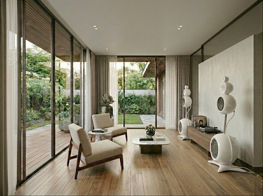 Garden-facing living room with visible audio equipment, pictured in the book.